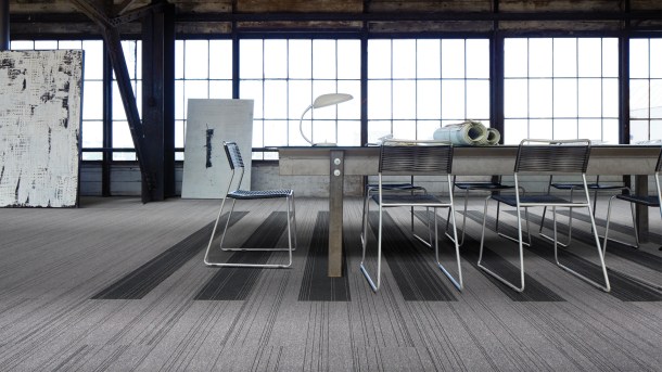 Office space covered with Interface carpet tiles made from 100% recycled yarn. 
