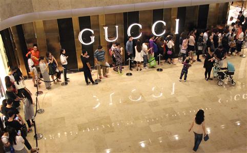 Queue outside the Gucci Shanghai store. Photo via The Time Out blog.